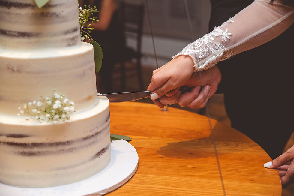 Bride and Groom Cutting Wedding Cake at Bedford Event Center