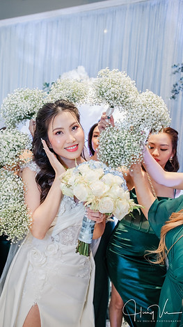 Bride Posing with White Rose Bouquet and Baby’s Breath Wreath at Bedford Event Center Wedding