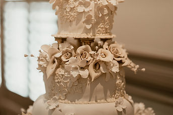 Ornate Ivory Wedding Cake at Bedford Event Center Reception